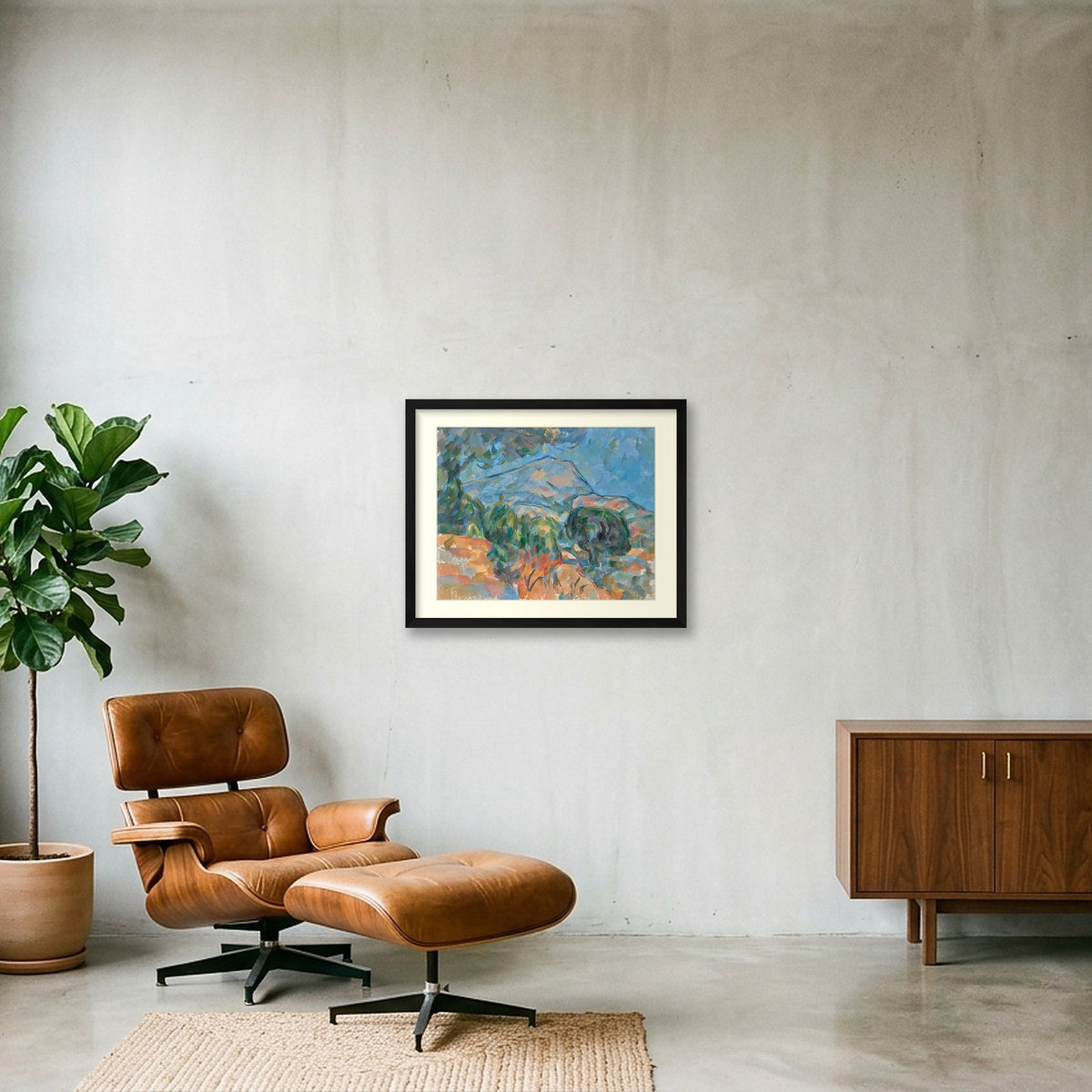 Digital room preview of Cézanne — Mount Sainte-Victoire with an ivory mat and black frame, beside a brown leather chair.