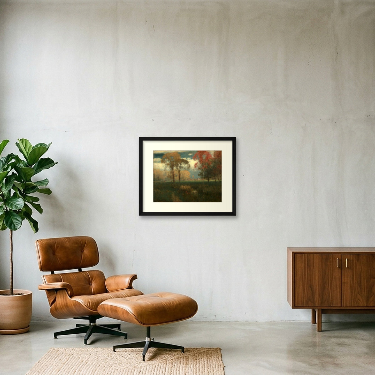 Digital room preview of Inness — Sunny Autumn Day with an ivory mat and black frame, beside a brown leather chair.